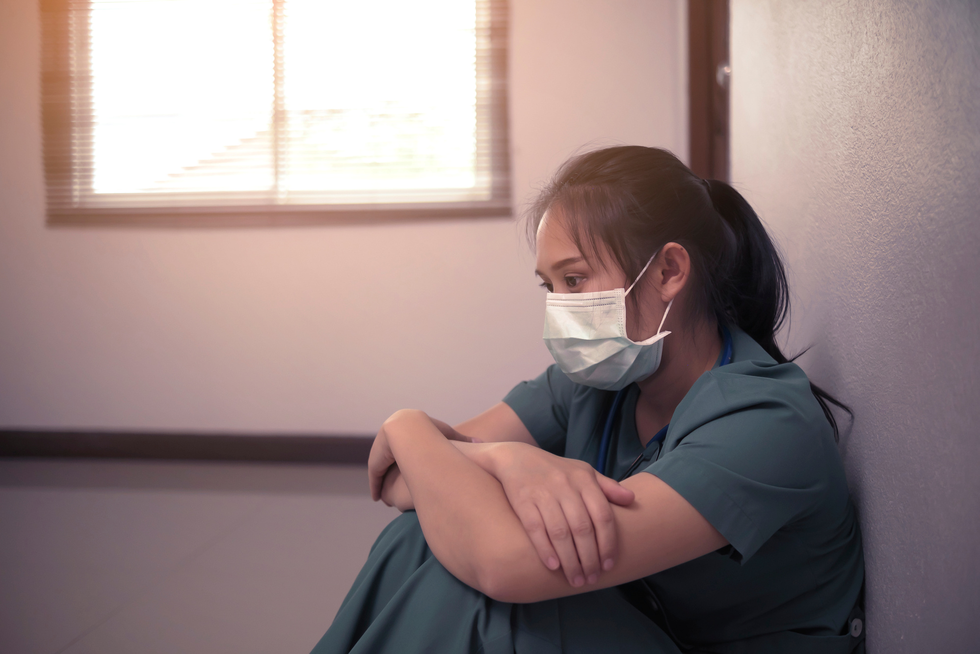 Stressed Nurse with Mask